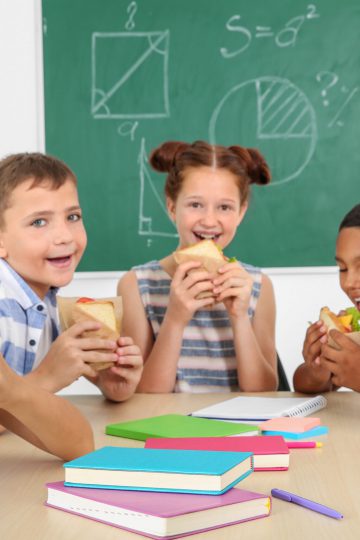 School aged children eating lunch