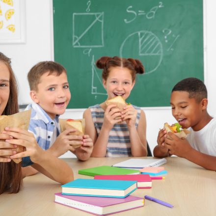 School aged children eating lunch