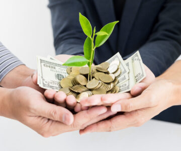 Blog One Detail Page NEW 2nd Replacement Image – hands holding growing money Suggested Crop